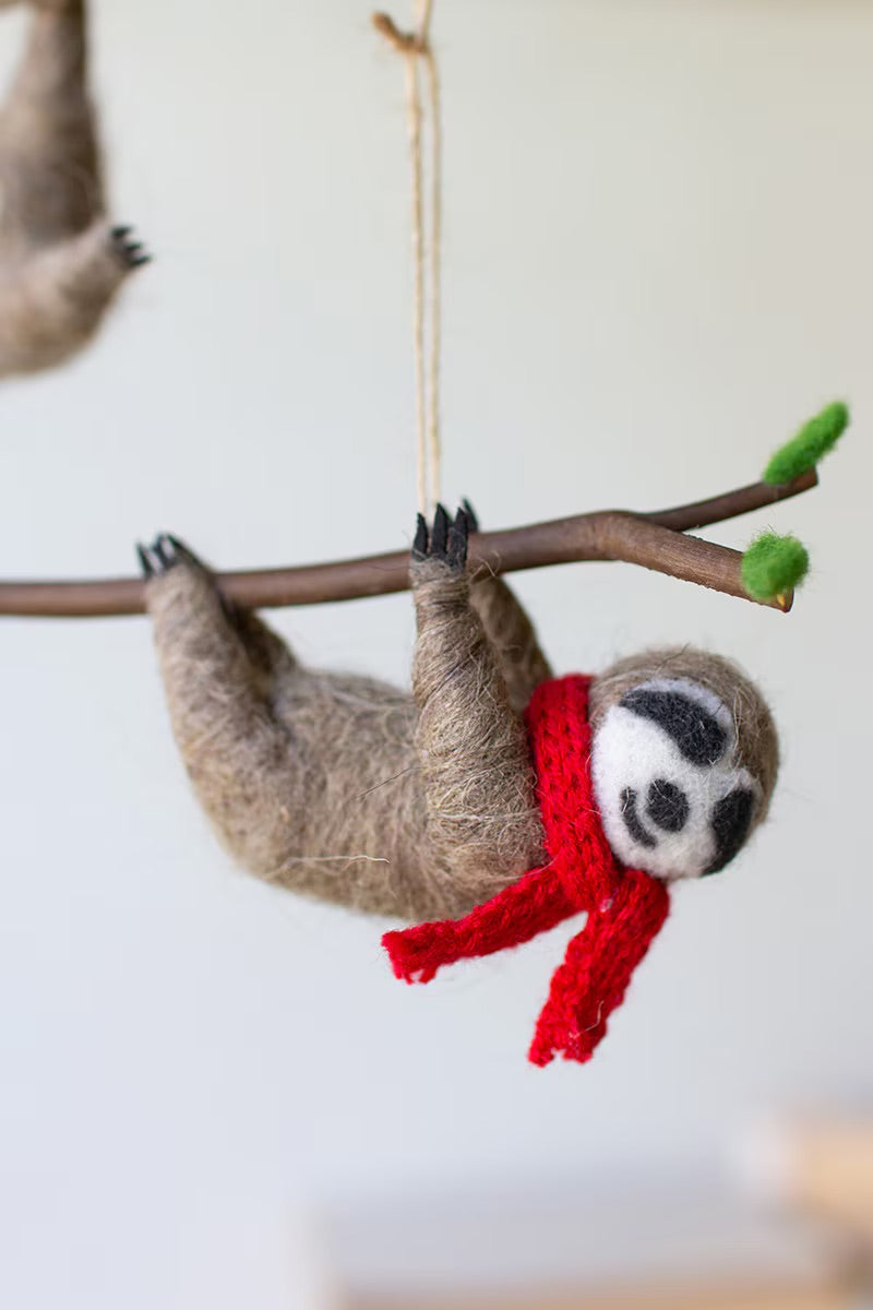 felt sloth ornament with red scarf