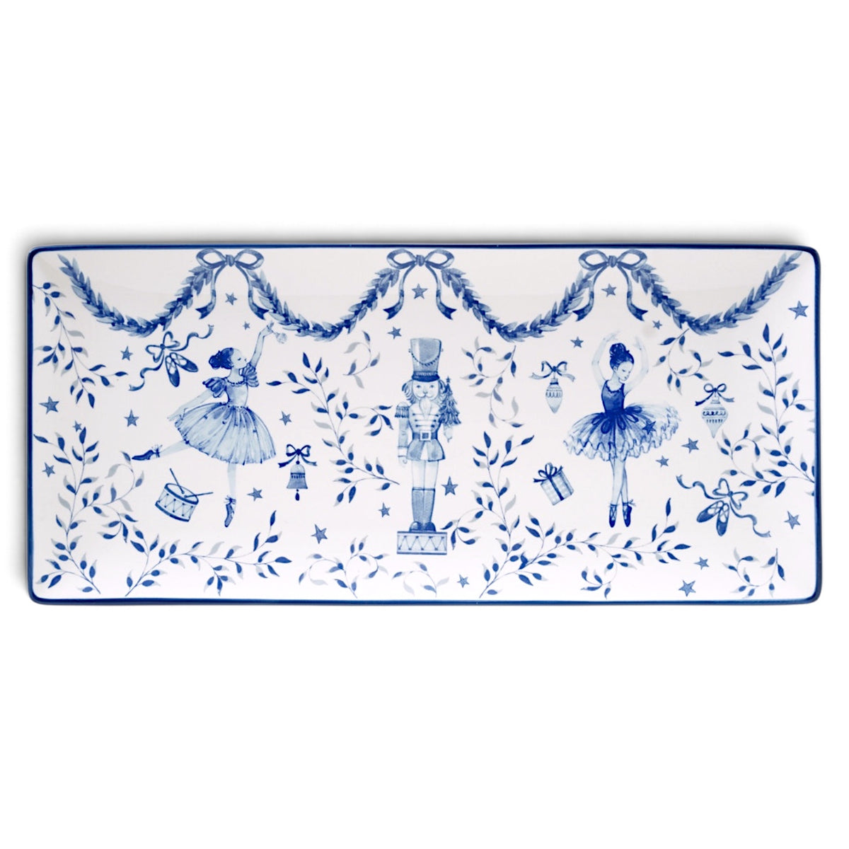 Rectangular white ceramic tray with blue ballerinas, a central nutcracker, leafy garlands, bows, stars, and a thin blue border