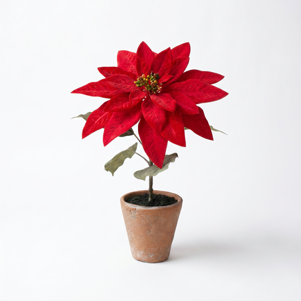 Artificial red poinsettia arrangement in a rustic cement pot for Christmas farmhouse holiday home décor.