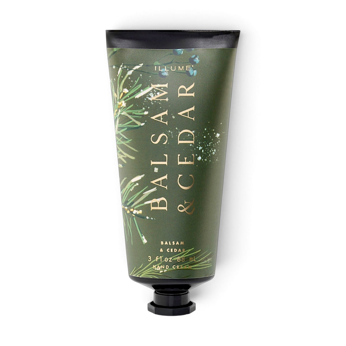 ILLUME Balsam & Cedar Demi Hand Cream in a green 3 fl oz tube with evergreen illustrations, gold lettering, and a black cap