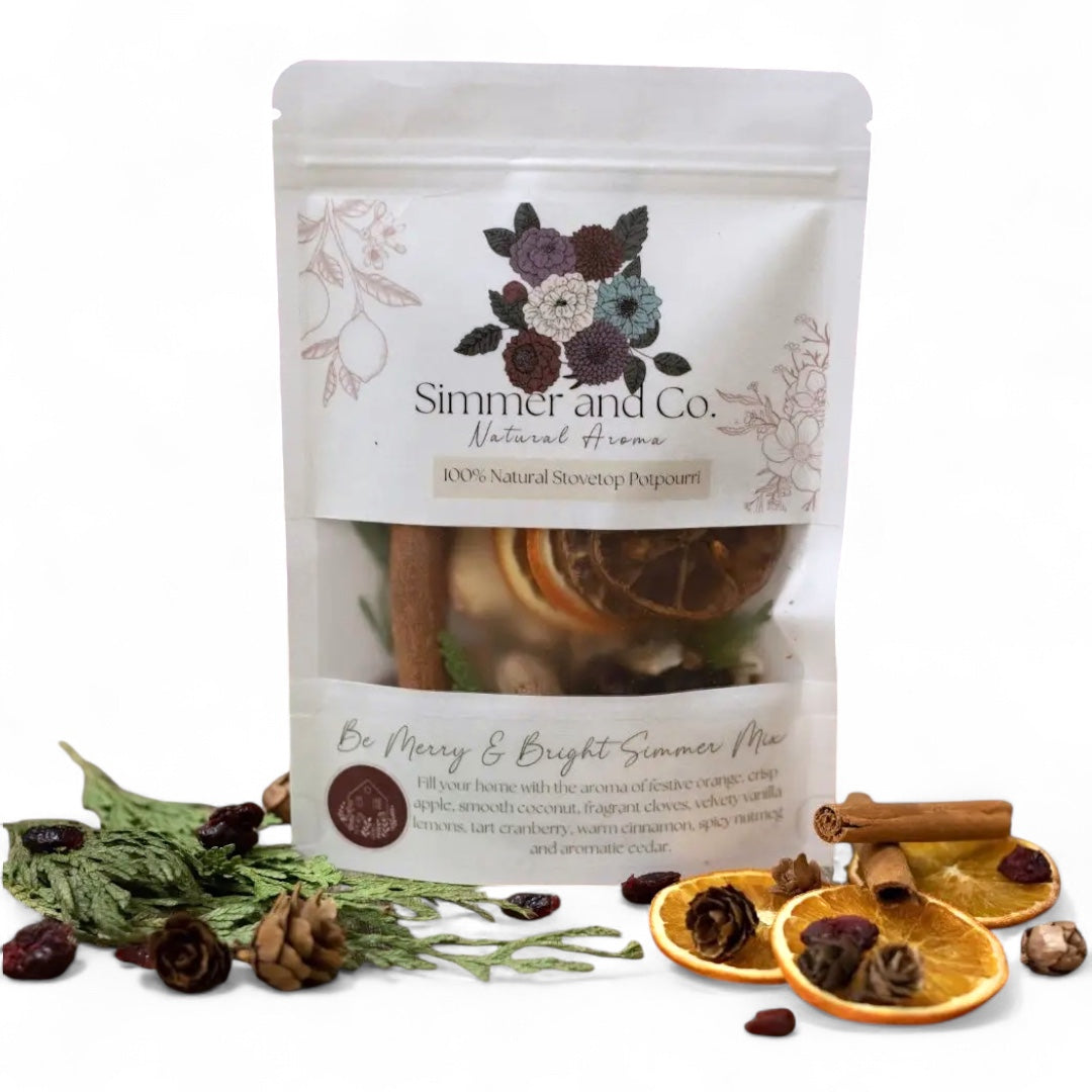 Be Merry & Bright simmer mix with orange, cranberry, cinnamon, and spruce in 4oz pouch
