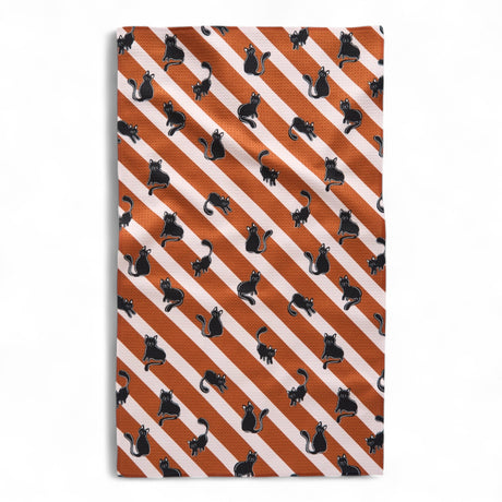 black cat pattern on orange and white striped tea towel