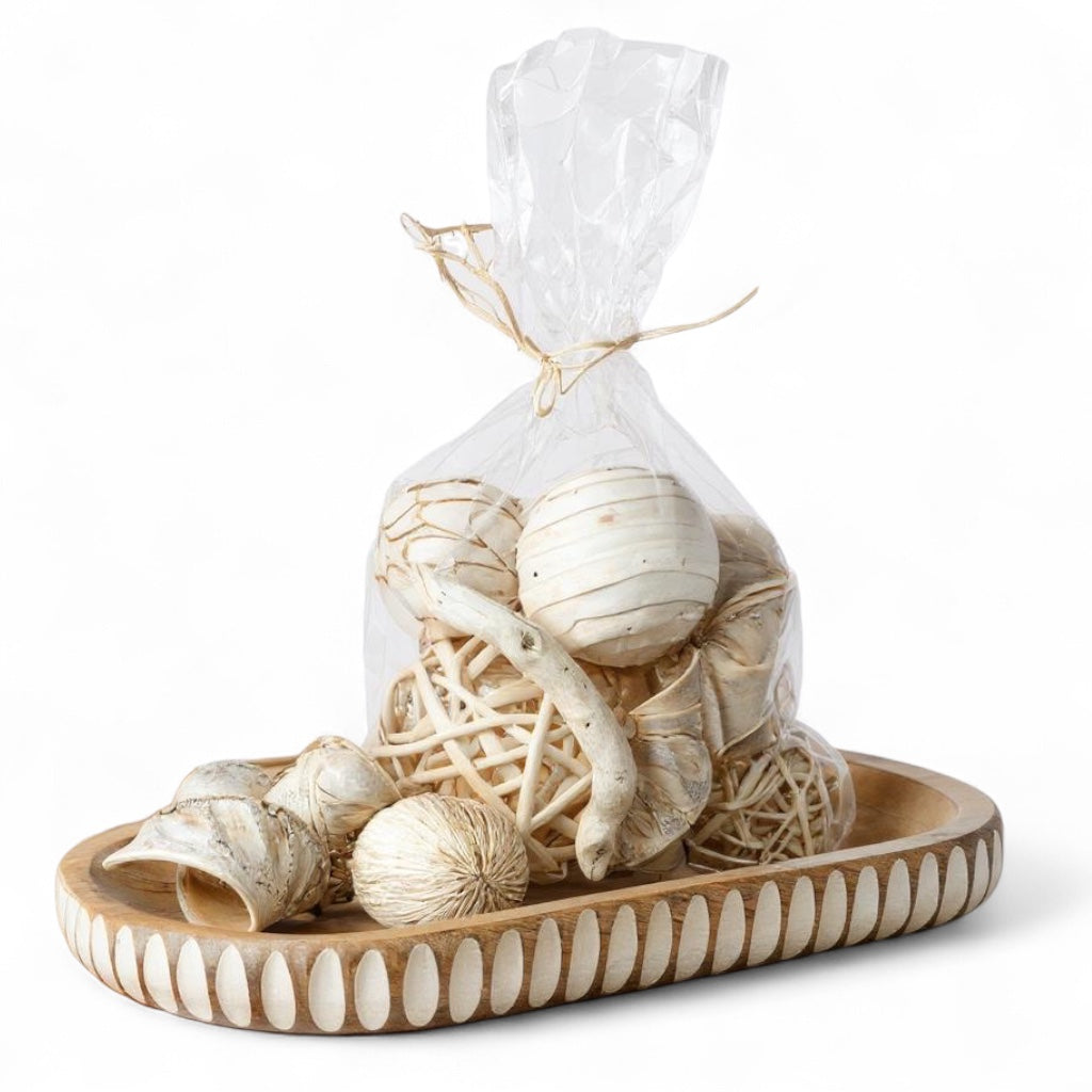 Assorted bleached wood decorative bowl filler packaged in clear bag