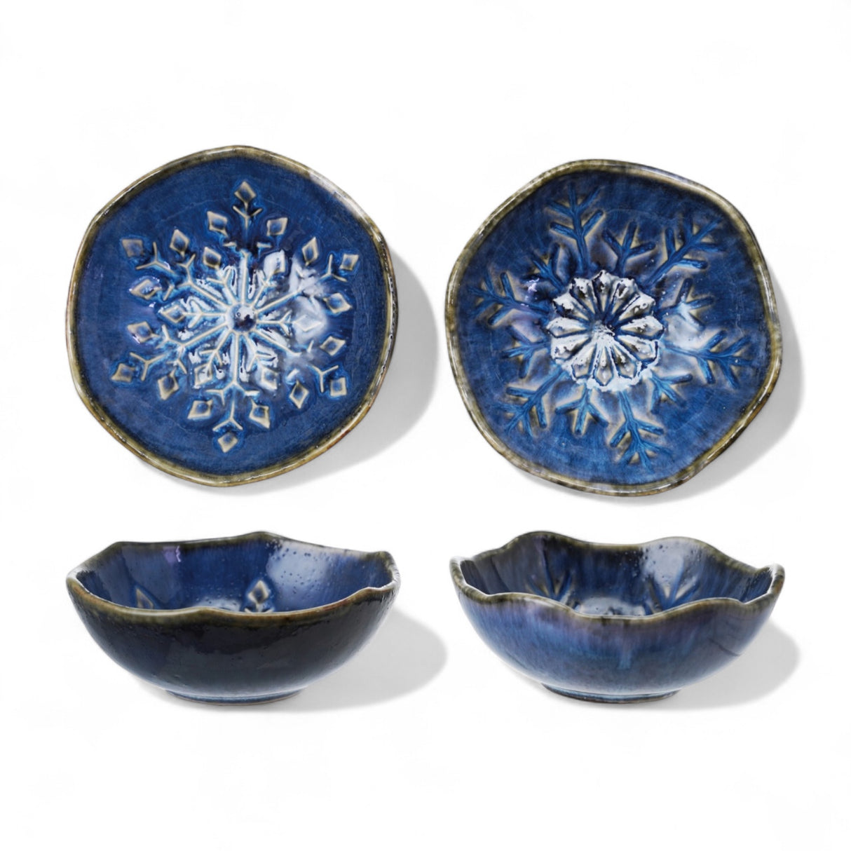 Blue stoneware bowls with snowflake design and reactive glaze