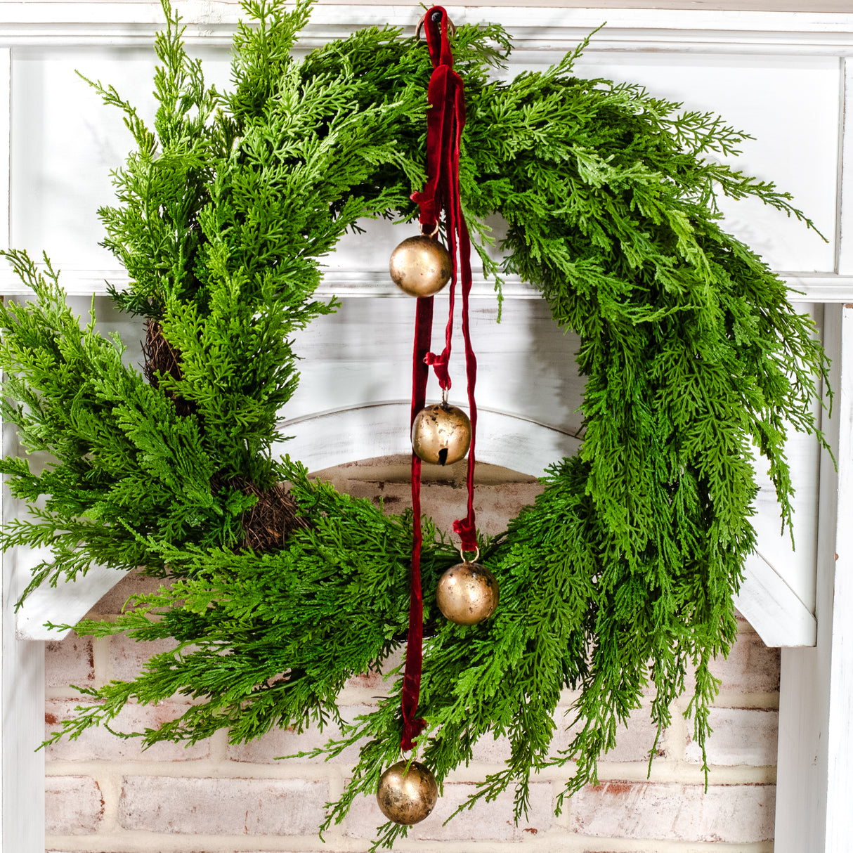 Burnt gold bell hanger with maroon velvet ribbon featuring four hanging bells