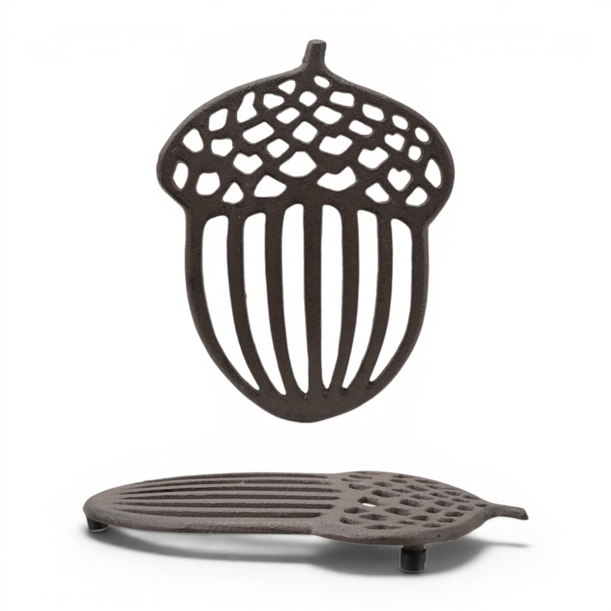 Cast iron acorn shaped trivet with openwork woodland design