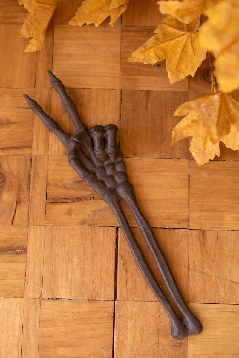 14-inch cast iron skeleton peace sign Halloween decor