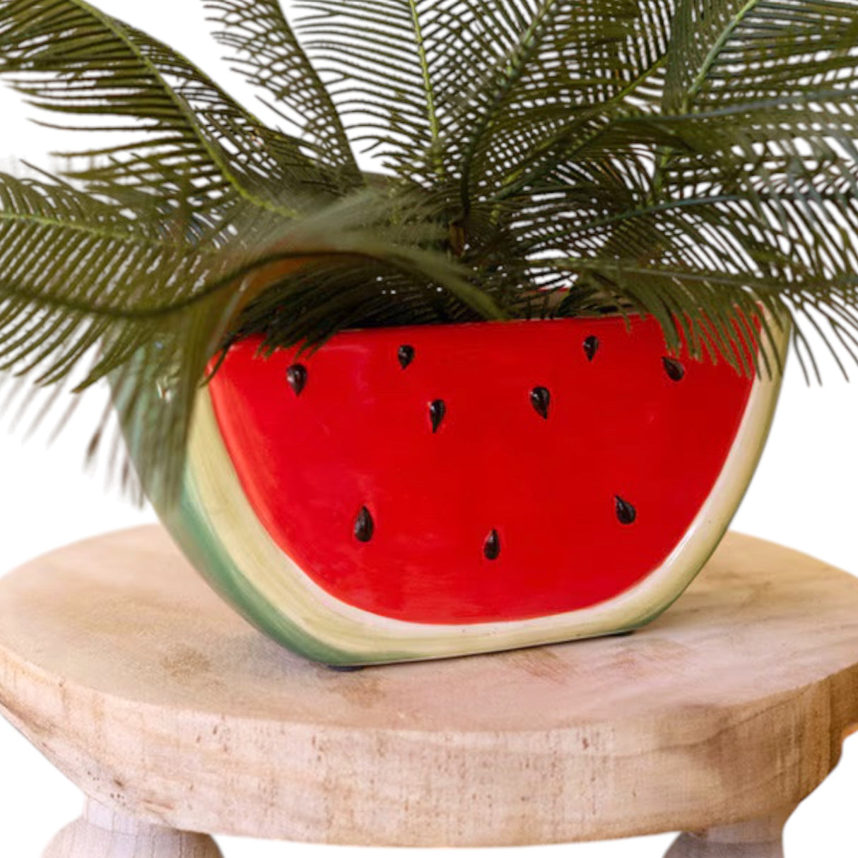 Glazed ceramic watermelon wedge planter with red interior and green rind design