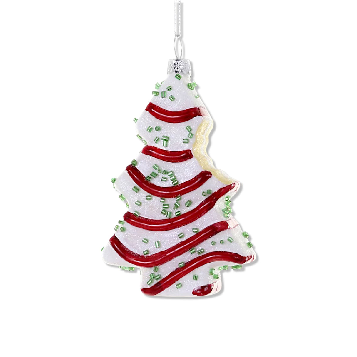 glass little debbie Christmas tree cake ornament with red icing and green sprinkles featuring a bite detail