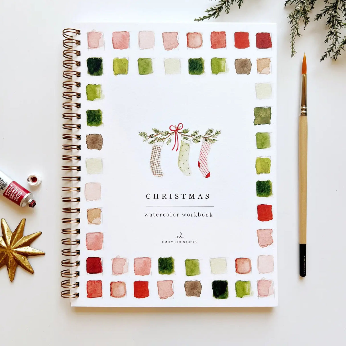 Christmas watercolor workbook with 12 festive holiday illustrations and painting instructions