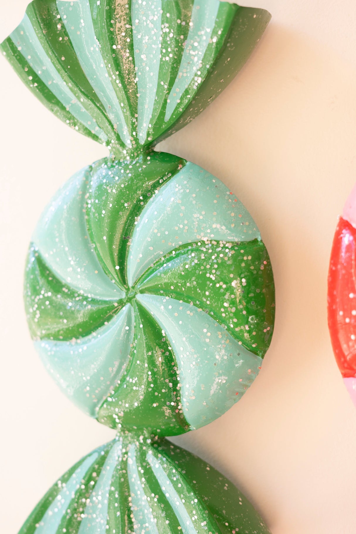Colorful Christmas candy ornament with curved ribbon ends