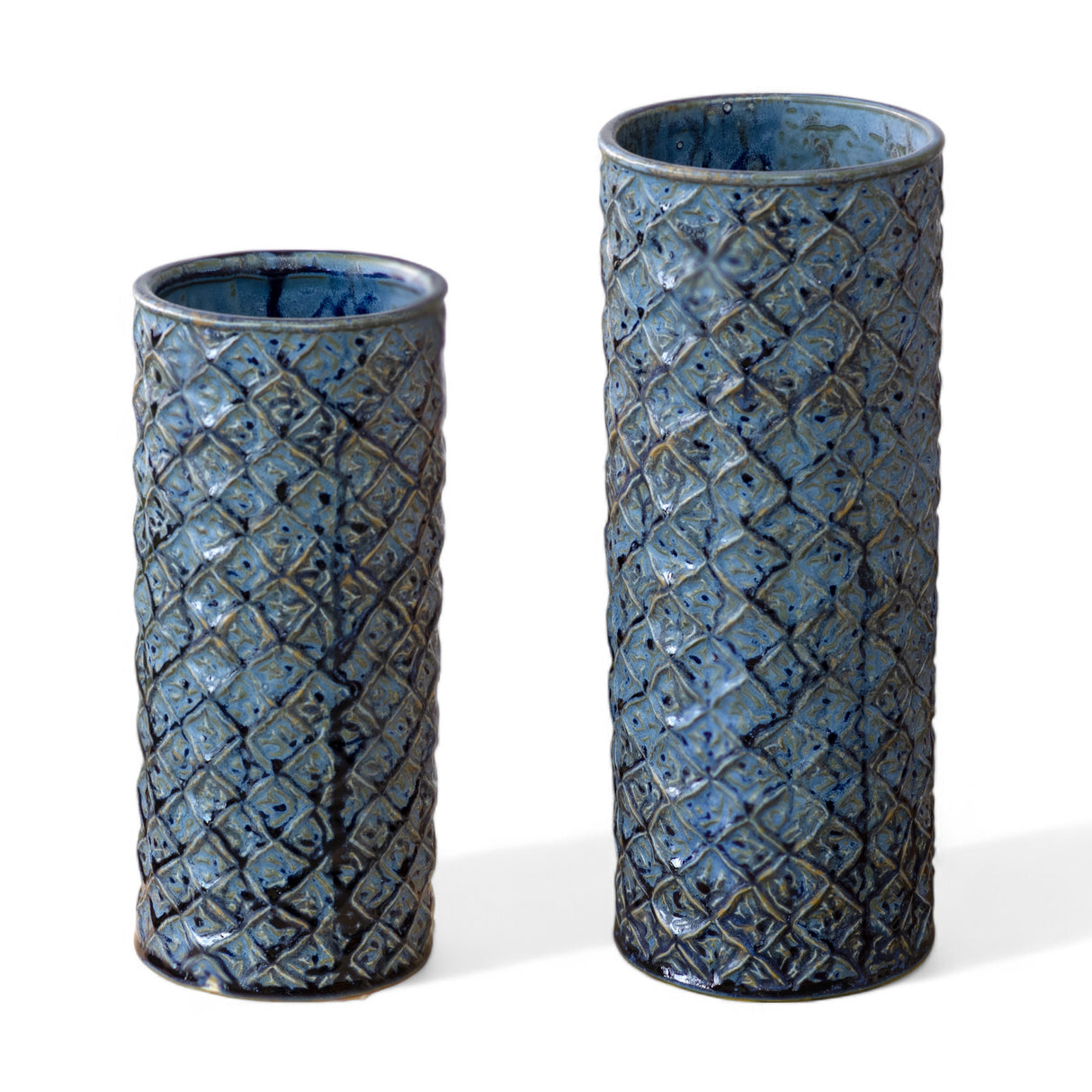 Two tall dark blue ceramic vases with diamond texture, in small and large sizes