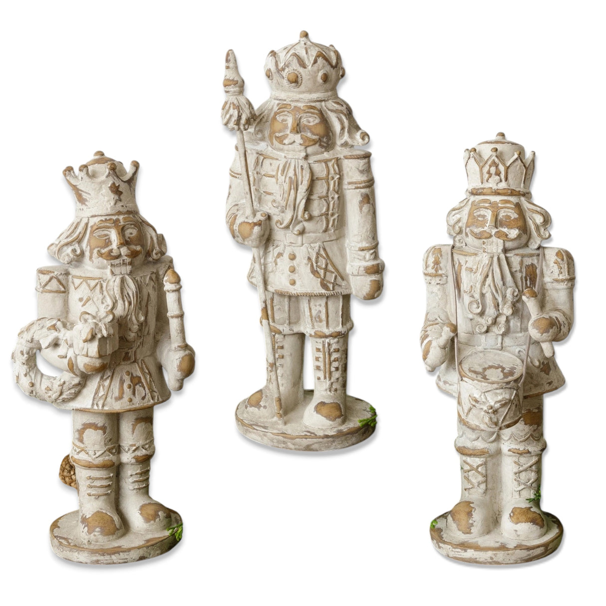 Distressed ivory resin nutcracker figurine with vintage-inspired details in three unique designs