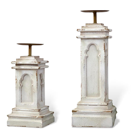 Distressed wood column candle holder with brass plate, available in two sizes.