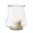 Clear speckled glass hurricane vase with candle inside