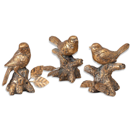 Set of three antiqued gold resin bird figurines, each perched on a textured branch or stump.
