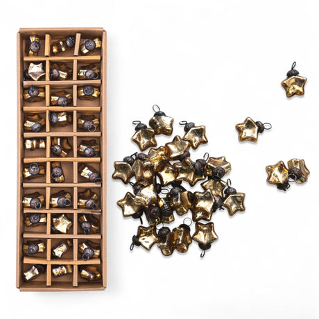 Set of 30 gold glass star ornaments with antique metal loops.