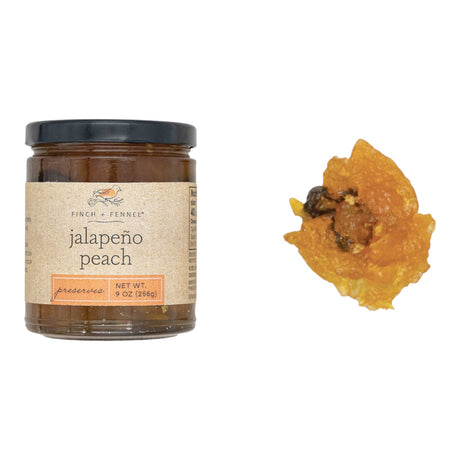 Jar of jalapeño peach preserves with a blend of sweet peaches and spicy jalapeños, ideal for dips, glazes, and charcuterie boards.