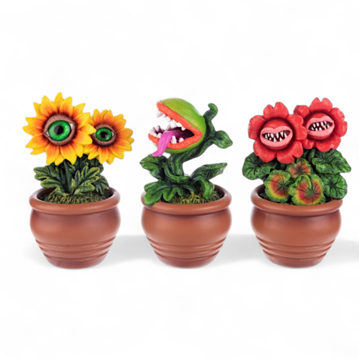 Assorted killer plant resin figurines in mini terracotta-style pots, each with creepy faces or sharp teeth