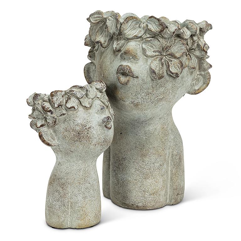 decorative cement face planters with floral hair detail for indoor plants