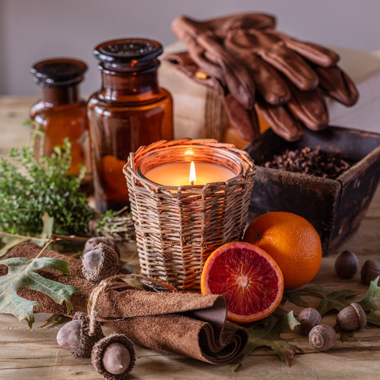 Leather and oak candle in woven willow container for rustic home fragrance