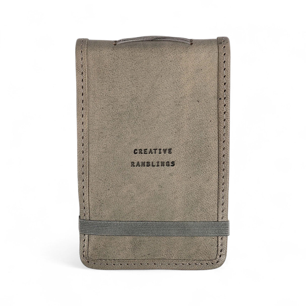 Stone color mini leather journal with “Creative Ramblings” quote and elastic band closure