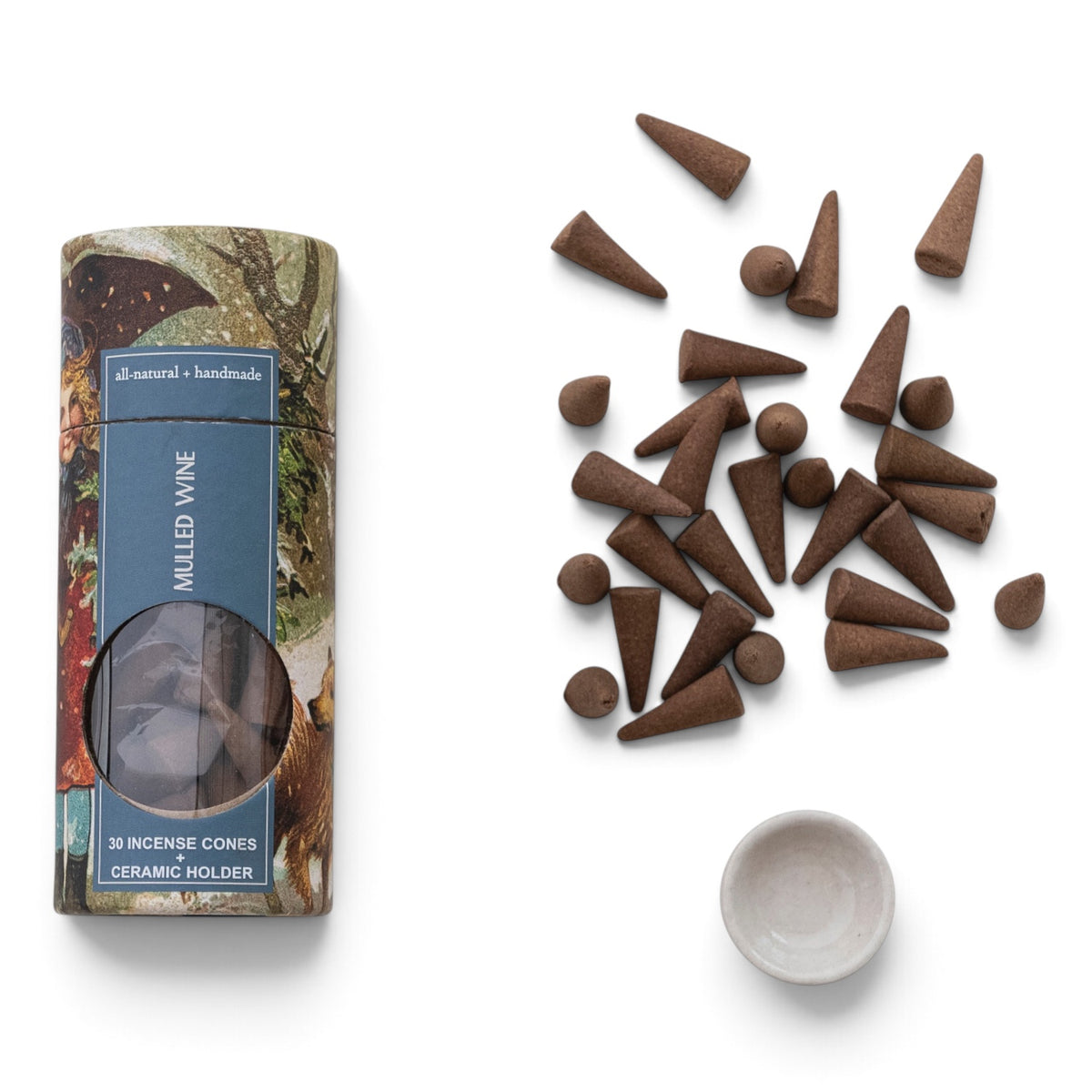 Mulled Wine handmade incense cones with a round white ceramic holder and vintage-inspired holiday tube with a blue label