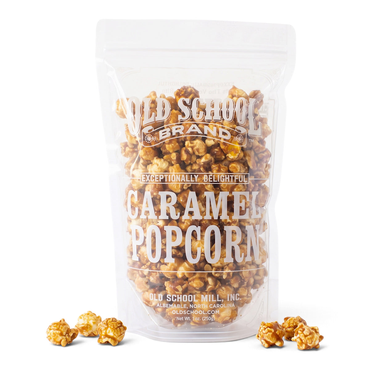 Old School Brand Caramel Popcorn in a clear 9-ounce resealable bag beside a glass bowl of golden caramel-coated popcorn
