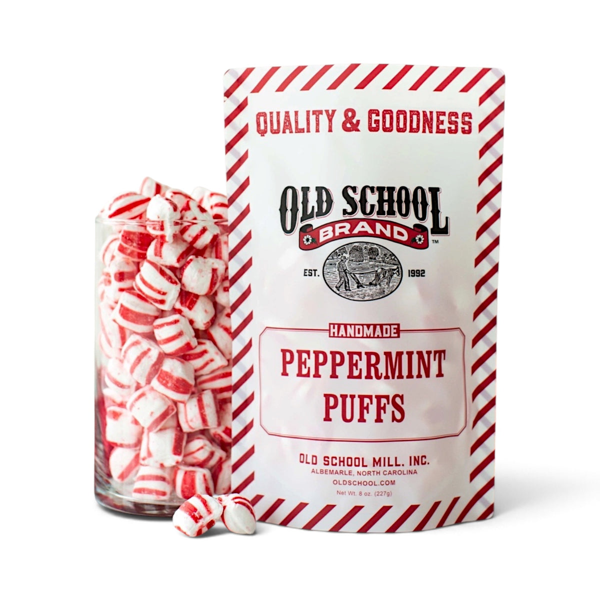 Old School Brand Peppermint Puffs in an 8-ounce red-and-white striped bag beside soft striped peppermint candies