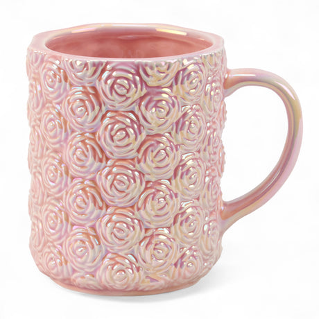Pink ceramic mug with sculpted rose design and pearlescent finish, 12 oz capacity