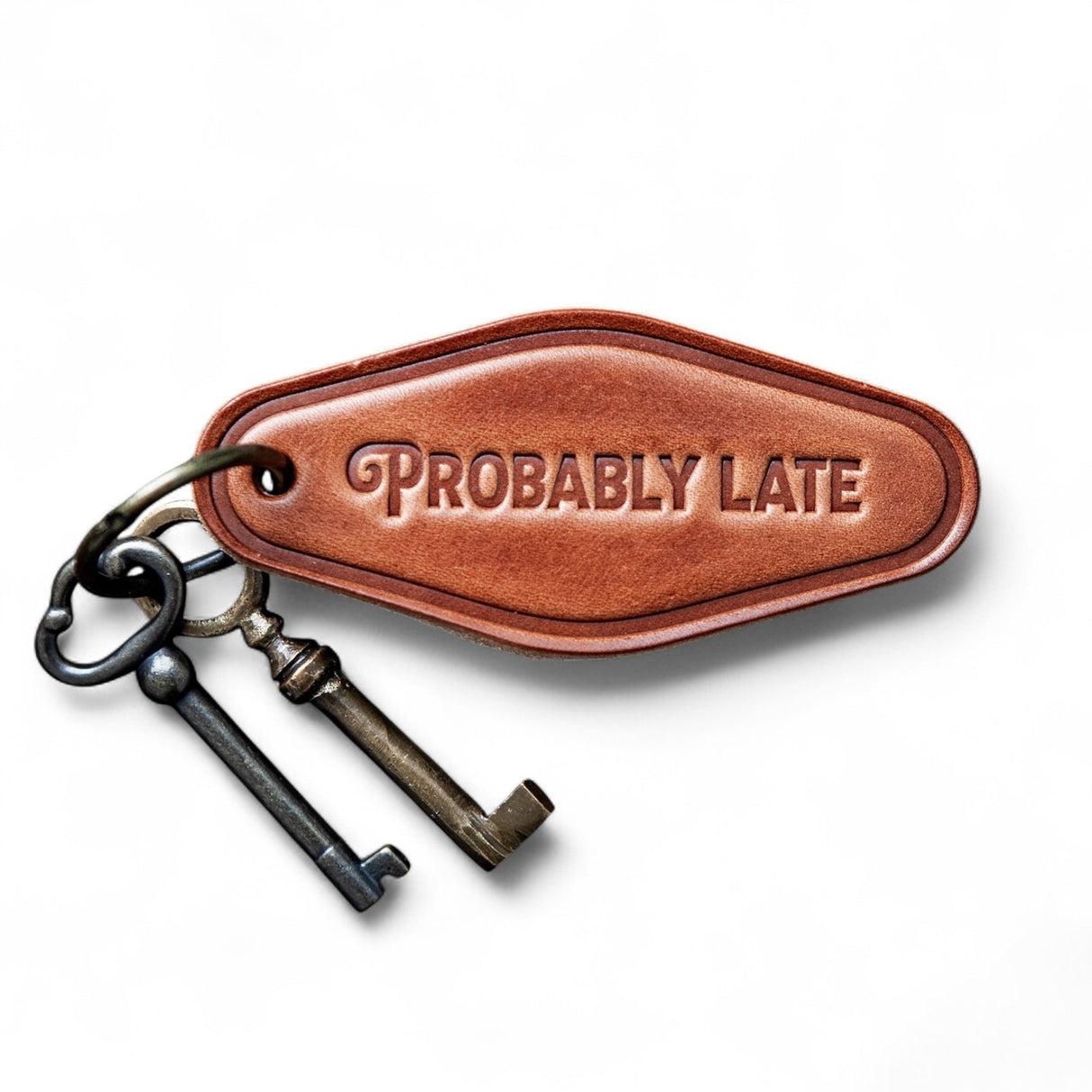Brown leather motel-style keychain stamped with Probably Late and antique-style keys on ring