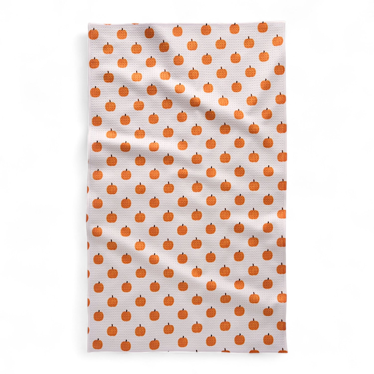 Tea towel with orange pumpkin pattern on a white background