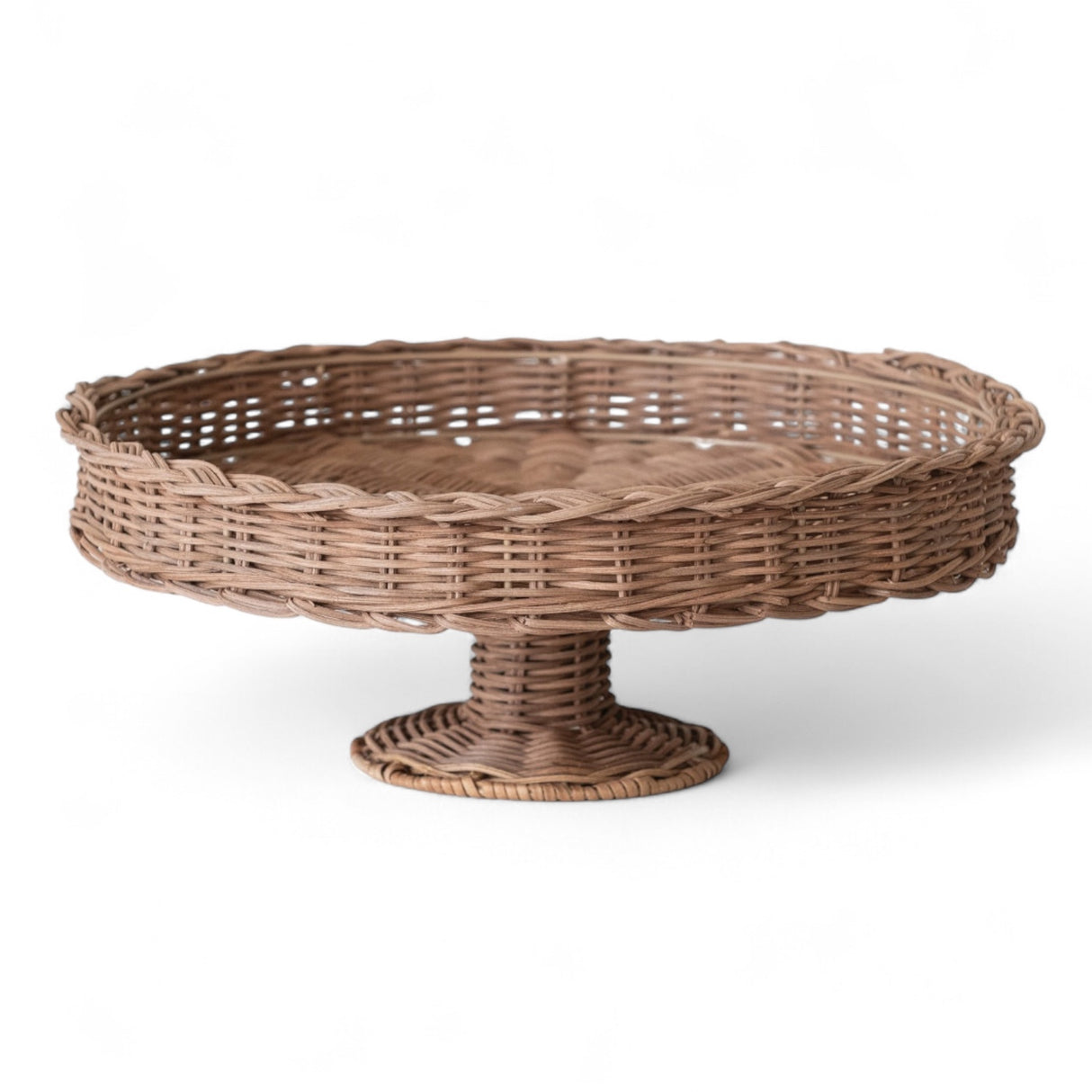 Natural hand-woven rattan pedestal stand with braided rim, 14 inches round.