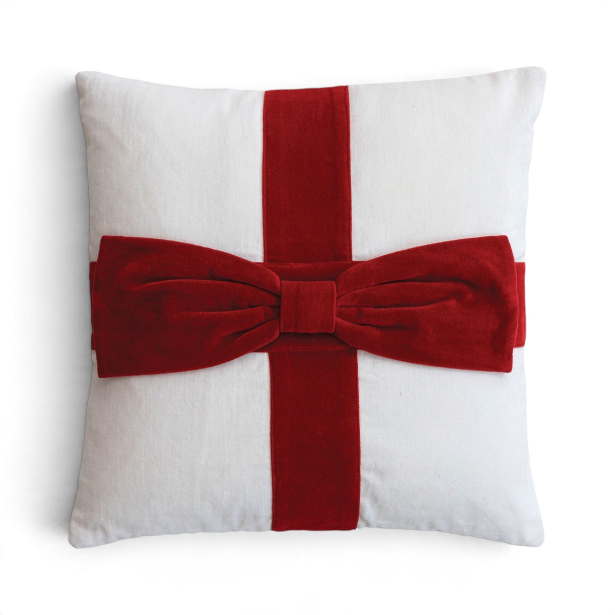White square cotton velvet pillow with crossed red bands and an oversized dimensional red bow resembling a wrapped gift