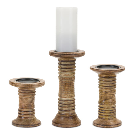 Three ribbed wood pillar candle holders in small, medium, and large sizes with metal inserts.