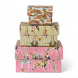 Stack of handmade recycled paper gift boxes with safari animal prints and gold cord closures