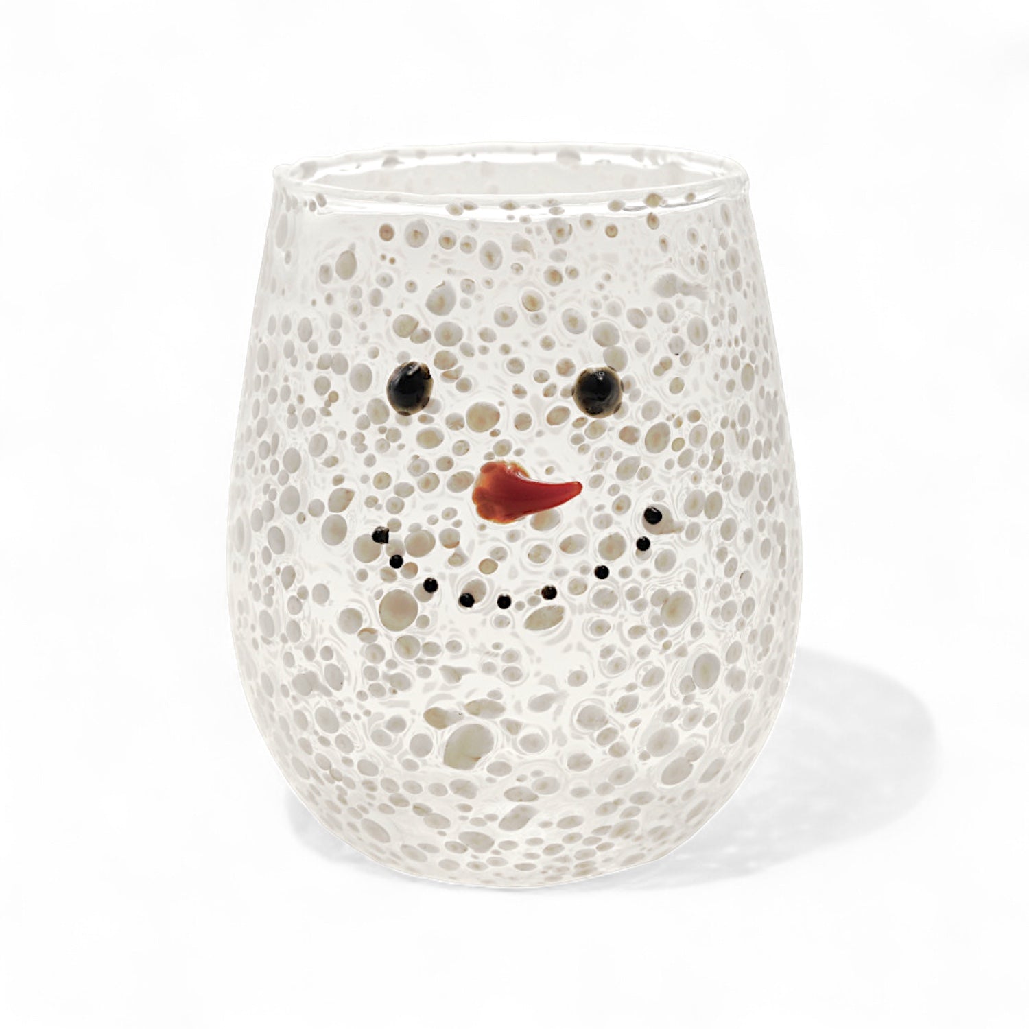 Clear confetti glass stemless wine glass with snowman face and carrot nose design.