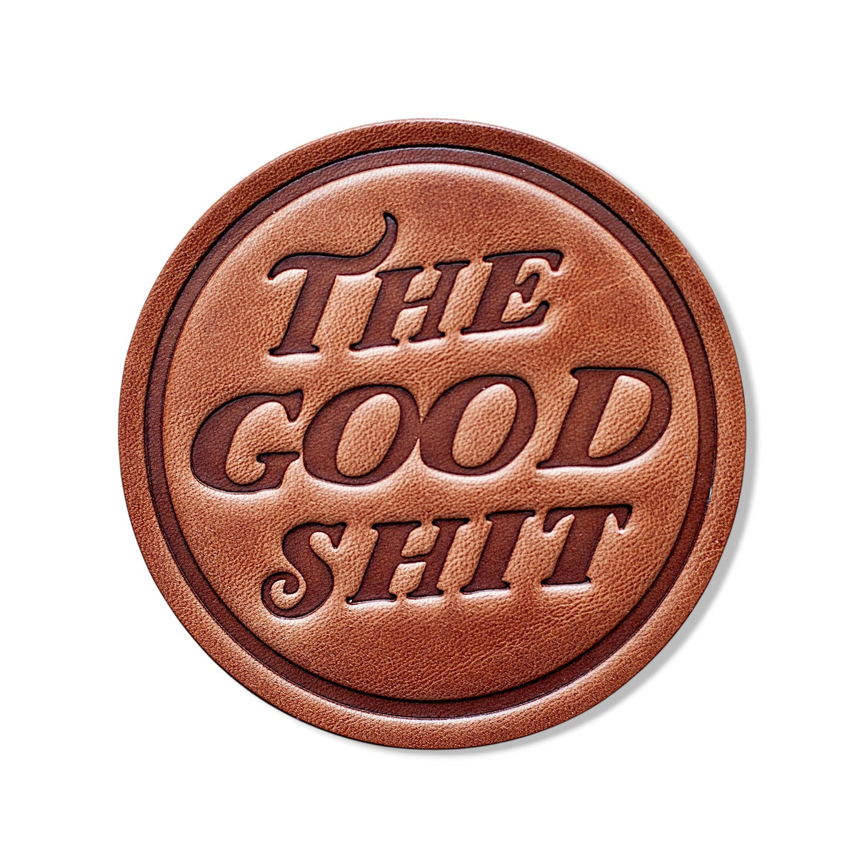 Round leather coaster stamped with The Good Shit, handmade in Texas