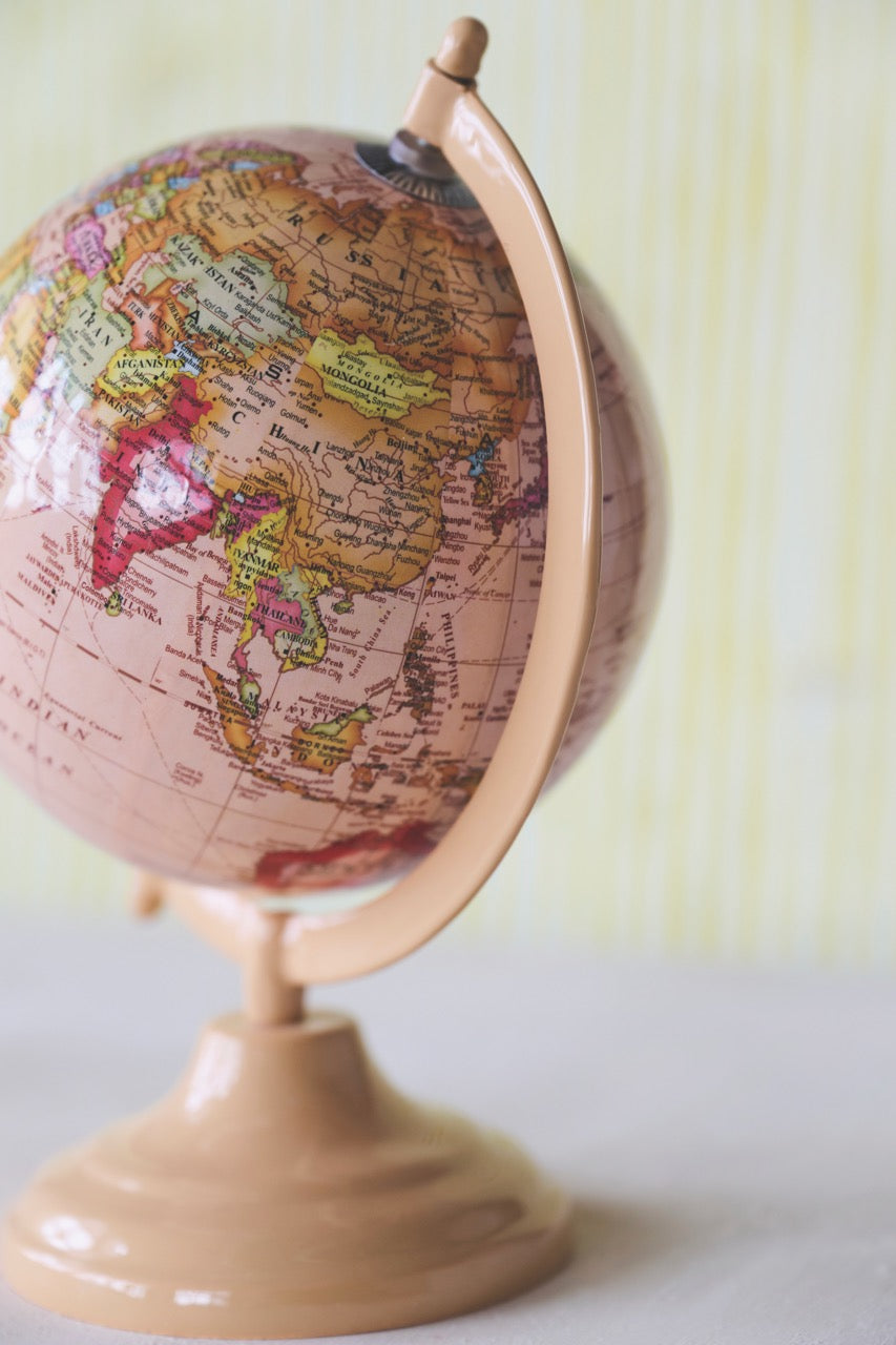 Vintage-Inspired Pink Globe on Metal Stand
