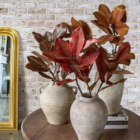 44-inch faux magnolia leaf stems in assorted brown and red fall colors
