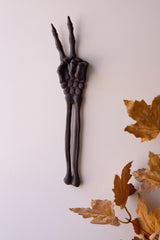 Cast Iron Skeleton Peace Sign
