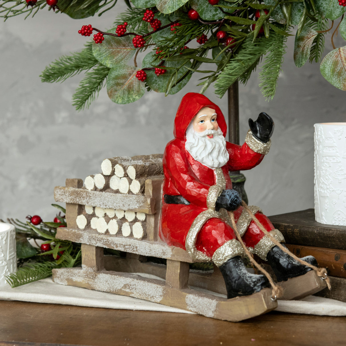 Red Sledding Resin Santa with Firewood