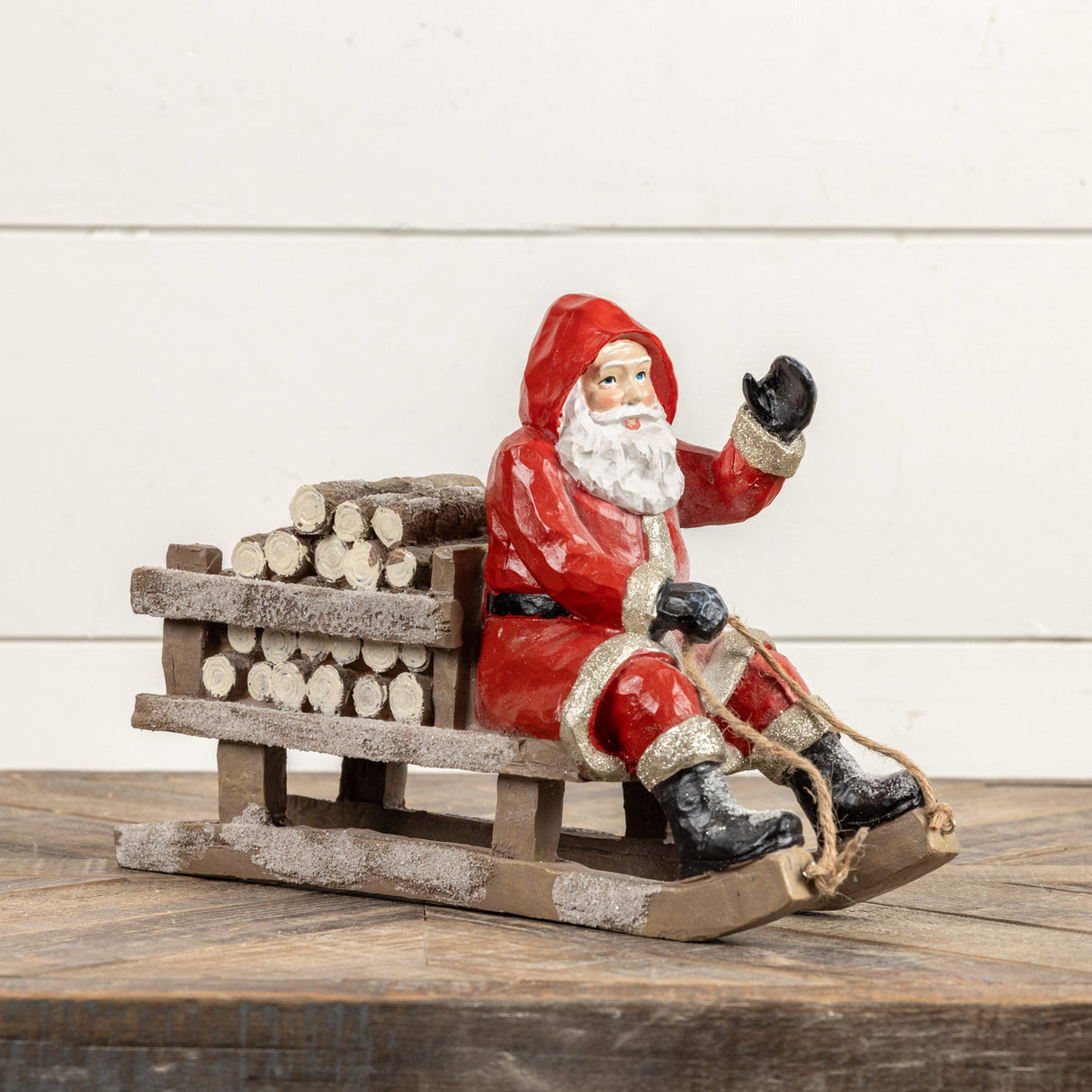 Red Sledding Resin Santa with Firewood