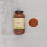 Finch + Fennel Tomato Basil Marinara Sauce jar shown beside a serving of sauce