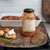Finch + Fennel Tomato Basil Marinara Sauce jar with baked pasta, onions and garlic