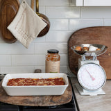 Baked pasta made with Finch + Fennel Tomato Basil Marinara Sauce in a rustic kitchen