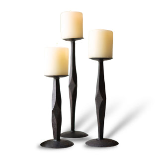 iron pillar candle stands in graduated sizes