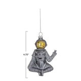 Glass Sitting Astronaut Ornament with Peace Sign & Silver Glitter