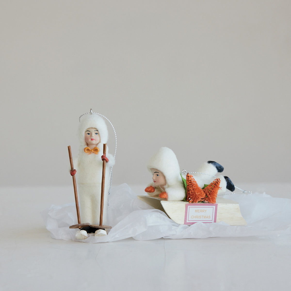 Child on Sled Christmas Ornament with Bottle Brush Trees