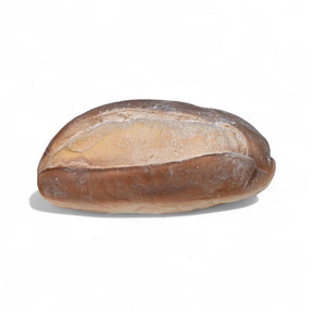 Realistic fake sourdough loaf with flour detail on a plate for home or retail decor